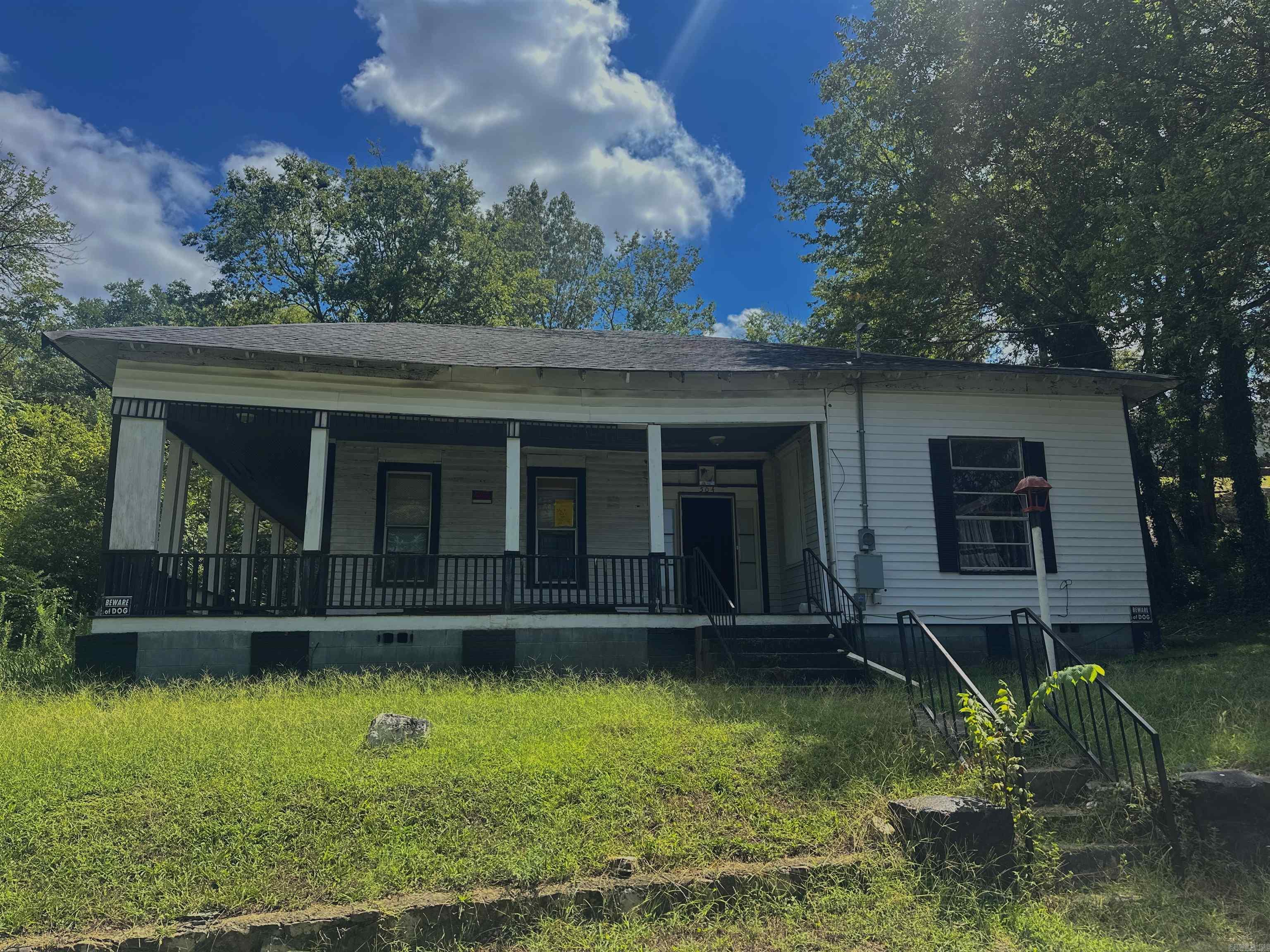 Attention investors and rehab specialists! This spacious 3-bedroom, 1-bath home, built in 1932, offers approximately 1,928 sq ft of interior space and sits on nearly half an acre in the heart of Hot Springs. With strong bones and classic architecture, this property is a prime opportunity for a full renovation or redevelopment. Whether you're looking for your next flip, a long-term rental, or a value-add resale, this one checks all the boxes. The home is being sold as-is and will require substantial work ā but with the right vision, it could be transformed into a beautiful residence or income-producing asset. Utilities are available, but there's currently no heating system in place. The large lot provides ample space for additional features such as parking, outdoor living, or even expansion. Conveniently located just minutes from downtown Hot Springs, shopping, dining, and local attractions, this property is positioned well for future appreciation. Priced below market to reflect condition ā donāt miss this rare opportunity to bring a historic property back to life and unlock its full potential.
