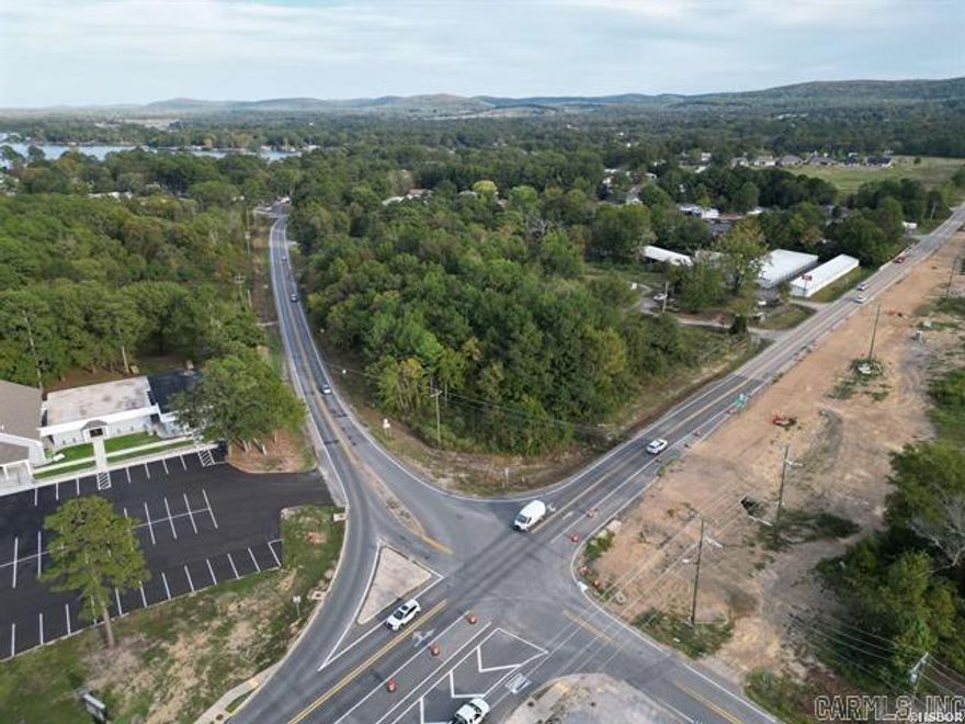Welcome to an exceptional commercial opportunity located just south of the city limits on Central Avenue, Highway 7 South. This property stretches between the Lake Hamilton bridge and Highway 290, now positioned along a completed highway expansion that has enhanced accessibility, traffic flow, and overall exposure. Surrounded by a growing commercial presence, the property benefits from several new businesses along this stretch, including the recently opened Family Market convenience store located directly across the street. Nearby you’ll also find a neighborhood strip center, restaurants, office buildings, Harp’s Food Store, a newly developed subdivision, and additional land ready for future development, creating strong potential for synergy and continued growth. The completed highway project has also added valuable frontage improvements, including expanded space and a partially paved entrance, allowing for easier access and added functionality for a variety of uses. All essential utilities and services, including water, sewer, electricity, gas, storm sewer, telephone, and garbage removal, are readily available, supporting a seamless transition for your commercial venture. Ingress