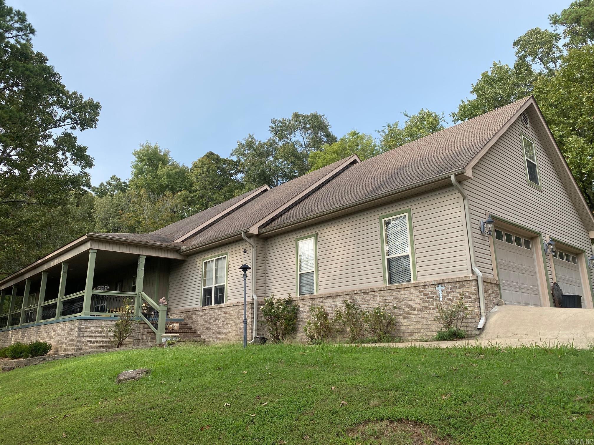 Beautiful Lakeview home located between Heber Springs and Eden Isle and just five minutes away from Heber Springs Marina. This spacious home boasts 4 bedrooms, 2 1/2 bath, large kitchen, formal living room, den with wet bar, and spacious area in fenced backyard perfect for entertaining. Enjoy beautiful sunsets from your expansive front porch or for more privacy just step out on your deck outside the master suite to relax. This home has so much to offer, call today and see for yourself!!!