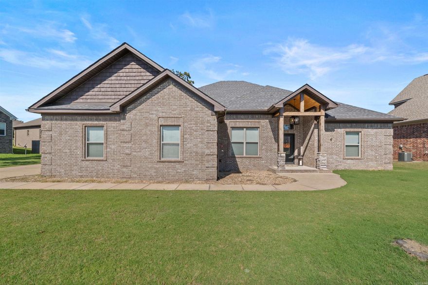 Built in 2018, this home features a functional split floor plan with an open concept living area, high ceilings, and a gas log fireplace. The kitchen, dining, and living spaces flow together for easy everyday living and entertaining. The primary bedroom includes a tray ceiling and an en-suite bath with separate vanities, a walk-in shower, and a soaking tub. The large primary closet connects directly to the laundry room for added convenience.  Outside, enjoy a covered back porch overlooking the fenced yard. The property also offers a side-load garage and a freestanding storm shelter located in the garage.