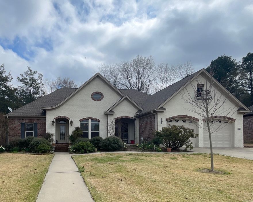 Custom built by Perrin Paul.  Lots of custom built ins and extras.  1/2 bath is in garage.  Huge sunporch off back.