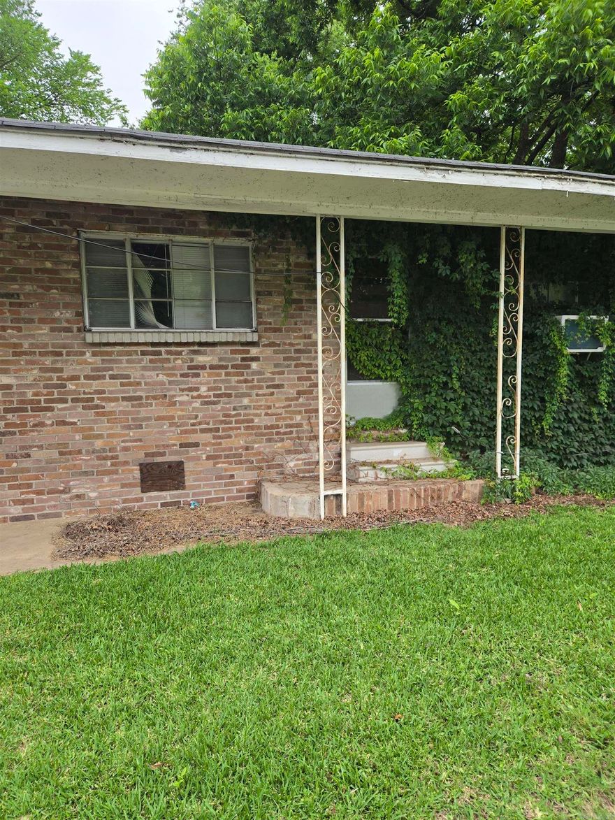 Brick Home Seeking New Owner: Loved by one family for decades, hoping to find a new owner willing to restore the pride of homeownership.  Needs a new roof and some updates.  Original hardwood floors, wood kitchen cabinets, with an attached carport for easy access during the rain. Nice-sized yard with great neighbors.