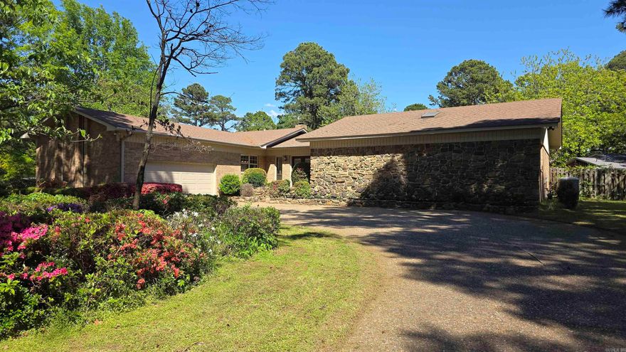 At 607 Old Post RD in Russellville, Arkansas, awaits a residential property providing a canvas for creating a personalized sanctuary, a place where daily routines unfold with ease and contentment. Three bedrooms allow for distinct personal spaces, offering peace and privacy for all inhabitants, or the flexibility to establish areas for creative pursuits or quiet reflection. The large dining room is currently being used as an office. There is a rock wall with fire place insert in the huge living room. Situated on a lot and a half, the outdoor expanse presents opportunities for cultivating a private garden oasis. Enjoy the deck and covered seating area with chiminea, or simply appreciate the surrounding natural peace. Pink and purple azaleas adorn the front yard. Plenty of storage is available on 7.5 X 6 foot storage closet off the garage and 8 X 13 storage building in the backyard. This property possesses an enduring appeal in an well established neighborhood.