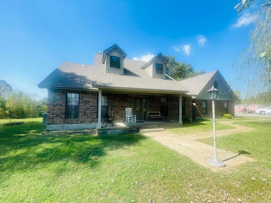 Enjoy the best of country living with this charming home offering 4 bedrooms, 3 bathrooms on 27.71 acres, pastureland-perfect for hay production or livestock. The property features 2 stock ponds, 2 shops, a barn and a covered shed offering endless versatility. Inside, you'll find 2 fireplaces, including one in the master bedroom with large sitting area and master bathroom and 2 guest bedrooms and bathroom downstairs and one guest bedroom and bathroom upstairs. A large pantry/laundry room, and an expansive deck ideal for entertaining or relaxing outdoors. New Architectural shingle roof in 2023 and HVAC with heat pump and water heater less than 7 years old.  A storm cellar off the deck gives that extra piece of mind.  Country living at its best. This rare find combines space, functionality and room to live, work, and play.  Agents, please see remarks.
