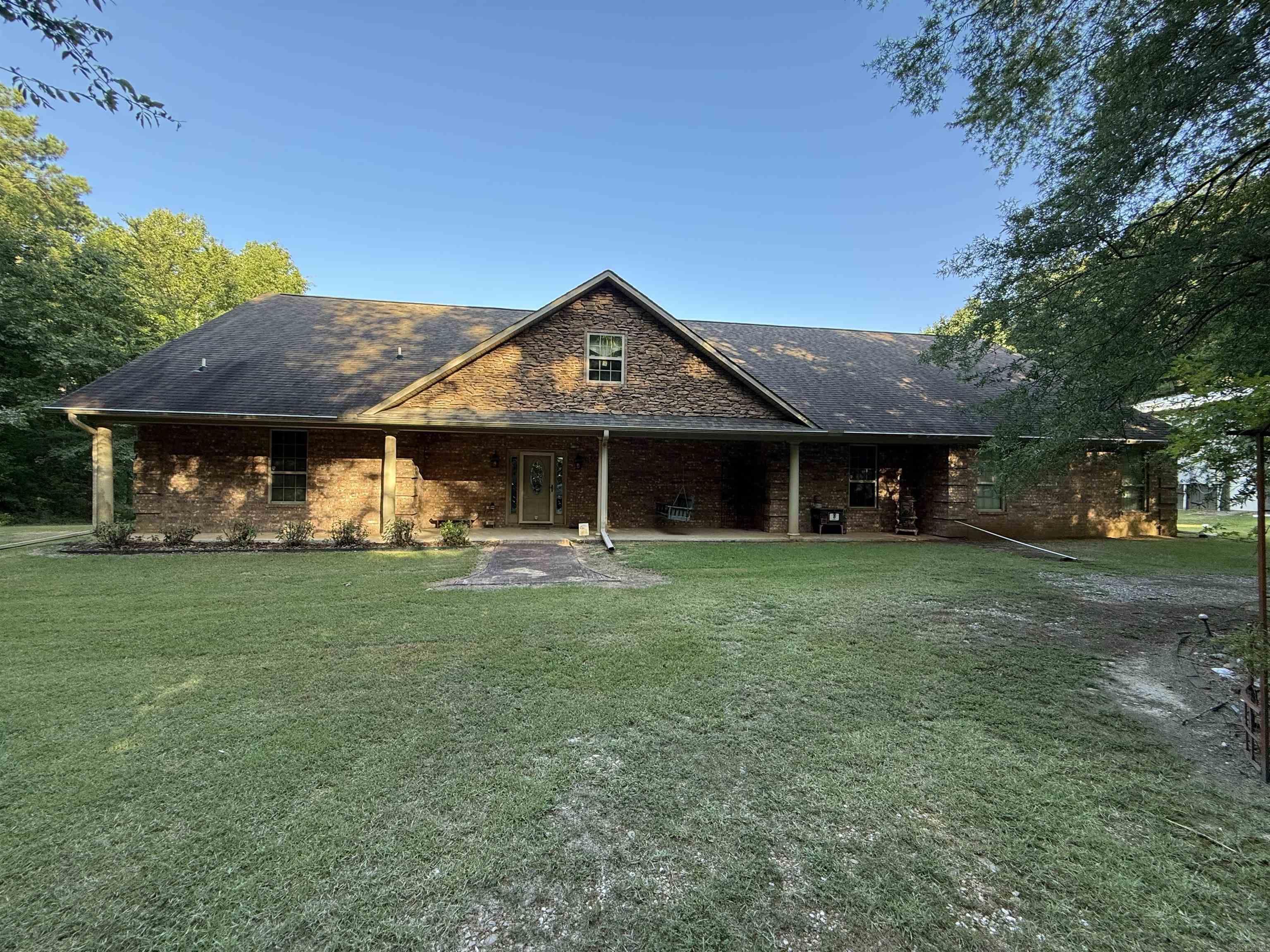 Secluded, private 40 wooded acres, custom built home, pond and 40x70 shop building. This property is one of a kind. Home was built in 2008 offers an open concept living room with fireplace, chef's kitchen with walk in pantry, granite counter tops, electric stove top, wall oven, dishwasher, refrigerator, breakfast bar and dining area, oversized master bedroom, master bath offers walk in tiled shower, jacuzzi tub and deep walk in closet. Additional bedroom with private bath, half bath for guest, office or additional bedroom, large laundry room with sink and extra cabinet space, sun-room off master, fully enclosed concrete safe room and double garage. CH/CA unit replaced in 2021 with 10 year parts warranty. Back porch over looks the pond with a gazebo, 40x70 shop building on concrete slab with electricity and 1/2 bath, two roll up doors one sized for an RV, offers wood working shop space and additional floored storage upstairs. 40 acres is mature mixed hardwood and pine. Contact our office for more details or to schedule a private viewing.
