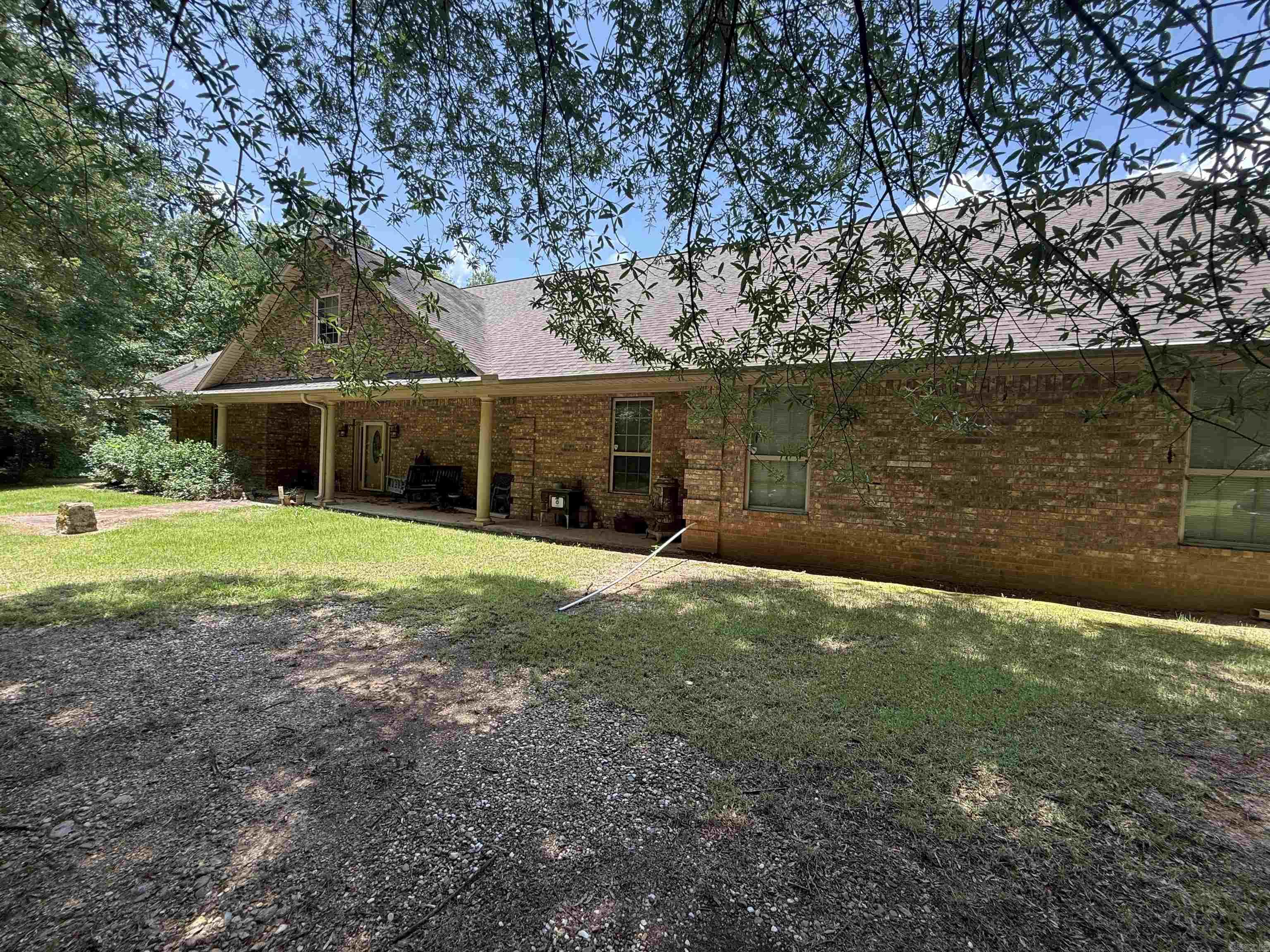 Secluded, private 40 wooded acres, custom built home, pond and 40x70 shop building. This property is one of a kind. Home was built in 2008 offers an open concept living room with fireplace, chef's kitchen with walk in pantry, granite counter tops, electric stove top, wall oven, dishwasher, refrigerator, breakfast bar and dining area, oversized master bedroom, master bath offers walk in tiled shower, jacuzzi tub and deep walk in closet. Additional bedroom with private bath, half bath for guest, office or additional bedroom, large laundry room with sink and extra cabinet space, sun-room off master, fully enclosed concrete safe room and double garage. Back porch over looks the pond with a gazebo, 40x70 shop building on concrete slab with electricity and 1/2 bath, two roll up doors one sized for an RV, offers wood working shop space and additional floored storage upstairs. 40 acres is mature mixed hardwood and pine. Contact our office for more details or to schedule a private viewing.