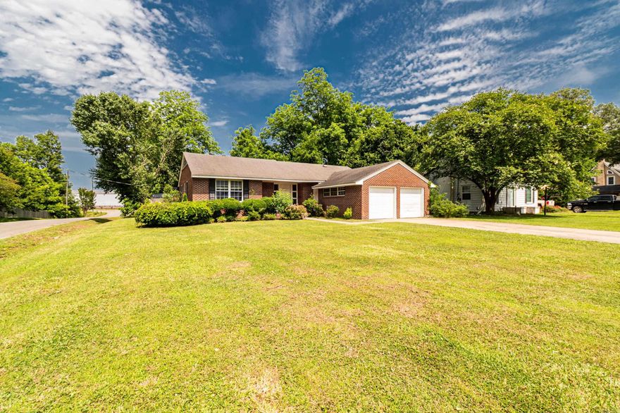 This classic 3-bedroom, 2.5-bathroom brick home full of potential and timeless charm. Nestled on a spacious corner lot in one of McGehee’s established neighborhoods, this property offers a solid foundation for your personal touch.  Inside, you’ll find generously sized rooms, a traditional layout, and original details that add character throughout the home.
