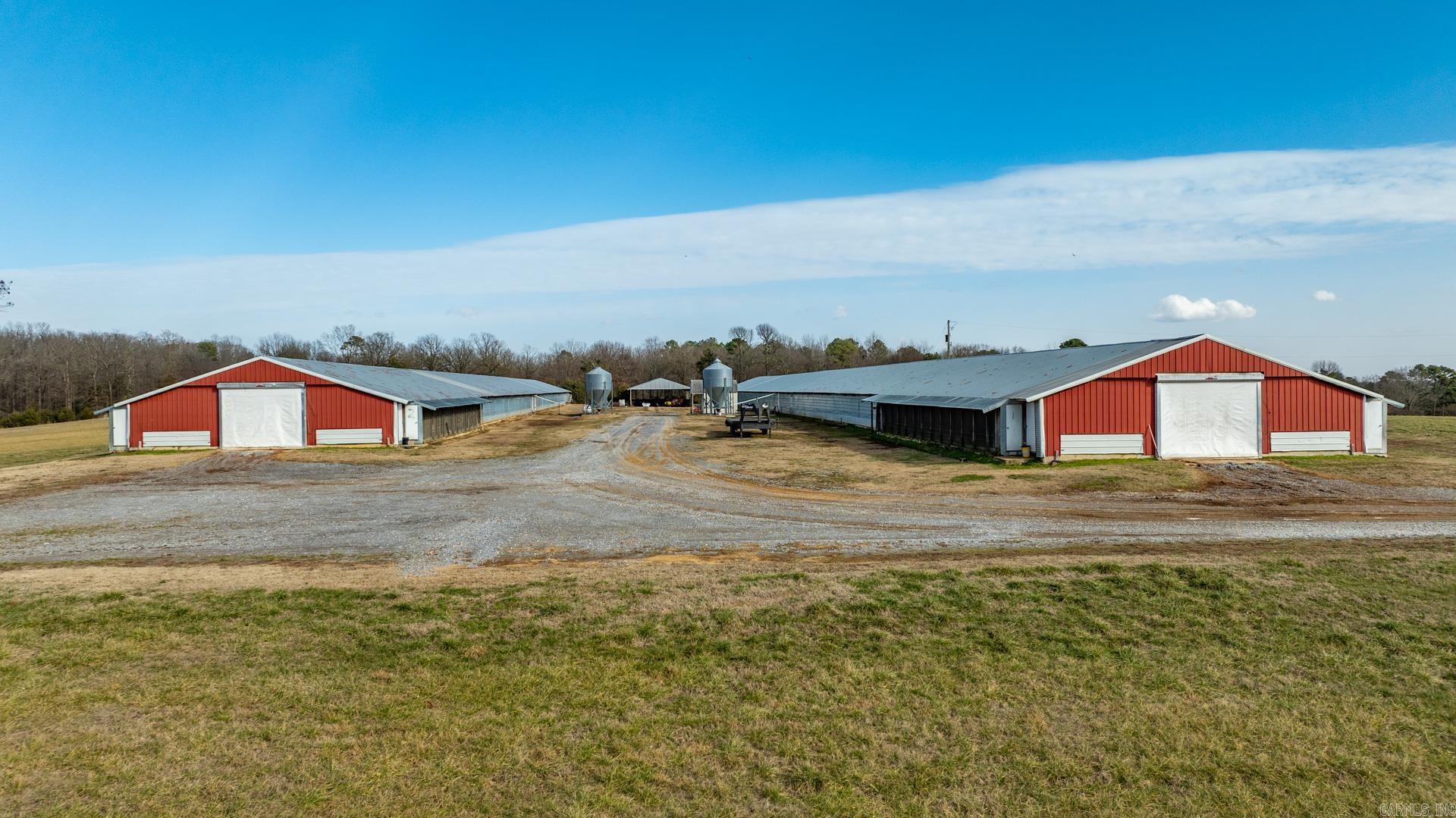 Income Producing hilltop farm with views in every direction. This farm is currently in operation with 2 Broiler Houses (40' x 450'), support buildings and over 1/2 mile of county road frontage. Many upgrades have been done over the years with wells, generator, computer-controlled auto feed and watering, radiator cooling fans. propane heat and closed-cell polystyrene insulation and there's plenty of room to build more. Owners are currently under contract with and producing for PECO FOODS. The property also has multiple ponds, beautiful hay pastures and wooded areas with wildlife.