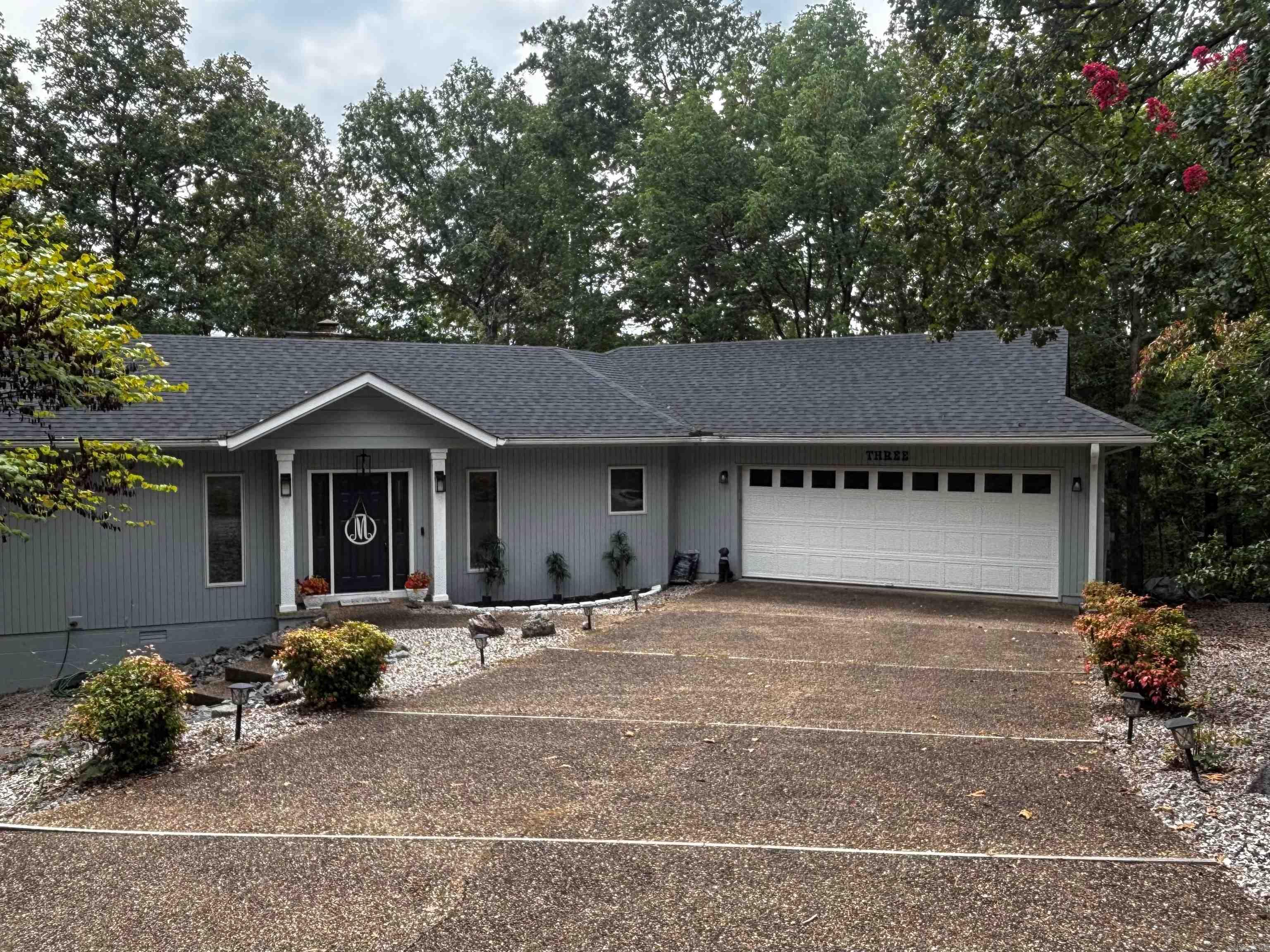 Located at the end of a quiet cul-de-sac, this well maintained 2-bedroom, 2 full bath home has neighbors and yet feels secluded. It is located in Lake Balboa neighborhood and only 2 minutes from DG Market. When entering the home, you notice the wood ceiling with skylights that accent the wood floors. The home features a split bedroom floor plan with both bedrooms showcasing private decks giving the feel of master suites on each end of the home. Your favorite space is sure to be the sunroom that has wall to wall windows that showcase the wooded feel of the home. The serene view feels like you are in a treehouse. Kitchen boasts granite countertops and stainless-steel appliances. Extra features include motion lights and a garage door camera that can be viewed and operated from your phone. New roof 2023, skylights 2023, exterior and some interior paint 2023. $2,000.00 new member buy in fee due at closing.