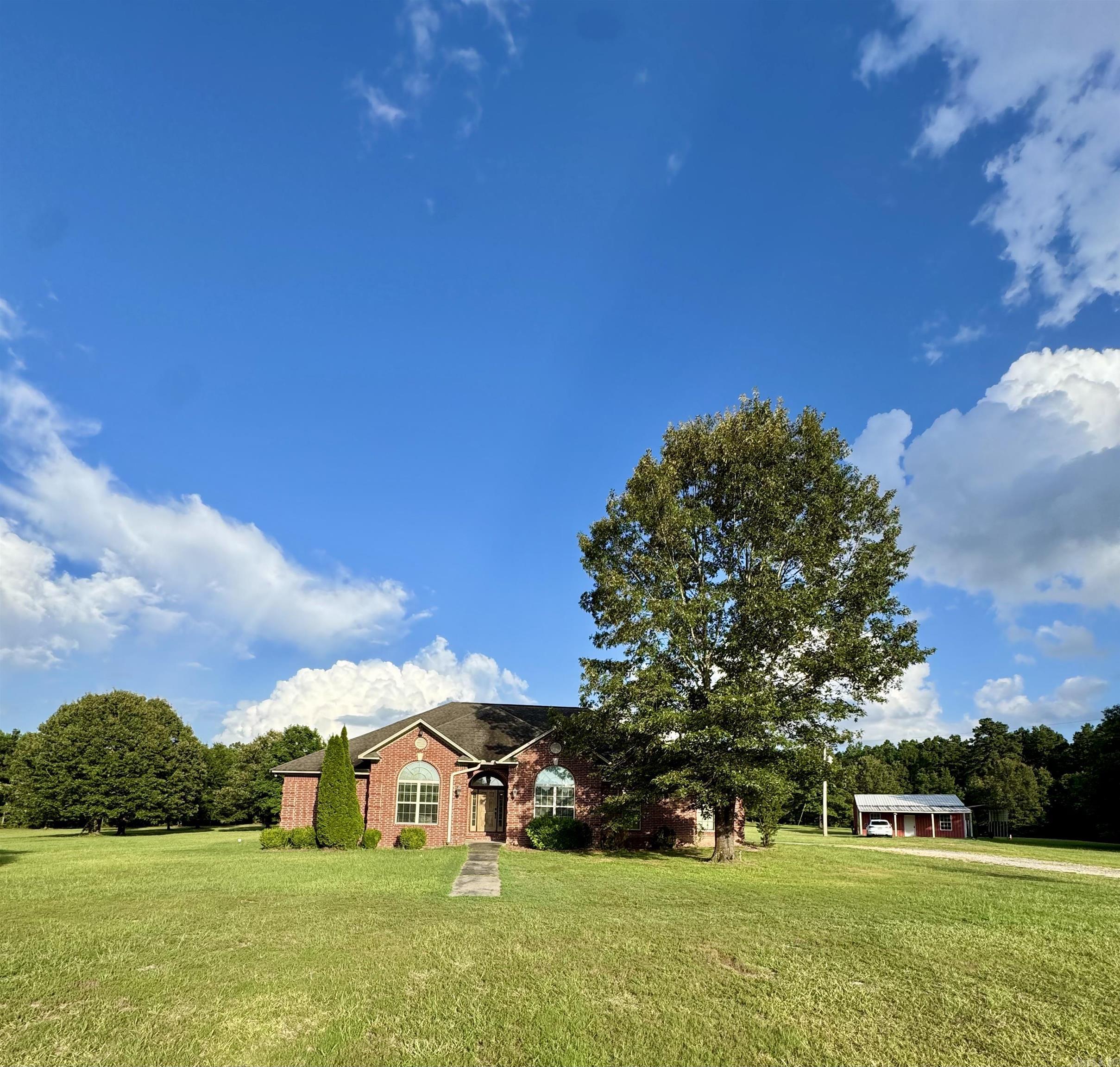 STUNNING, FULLY RENOVATED LUXURY RETREAT ON 10.902 ACRES! Experience refined of nearly 2900 Sq Ft., of country living in this beautifully reimagined estate, offering both elegance and functionality. Nestled on nearly 11 acres of private land, this exquisitely remodeled home boasts an impressive list of upgrades, including all-new flooring, designer fixtures, premium countertops, modern appliances, and fresh interior and exterior paint. Additional highlights include a spacious living area, laundry room, luxurious kitchen, new showers and tub, and an attached 2-car garage. Enjoy resort-style outdoor living with a sparkling inground pool and expansive patio—perfect for entertaining or relaxing in your own serene oasis. A versatile 20x30 shop that offers endless possibilities, from guest accommodations, MIL quarters, to income-producing rental. In addition, a ready to be restored pond offers the perfect opportunity for peaceful reflection, fishing, or farming. Whether you’re seeking privacy, country living, space, or sophistication, this property delivers it all. Call today to schedule your private tour!