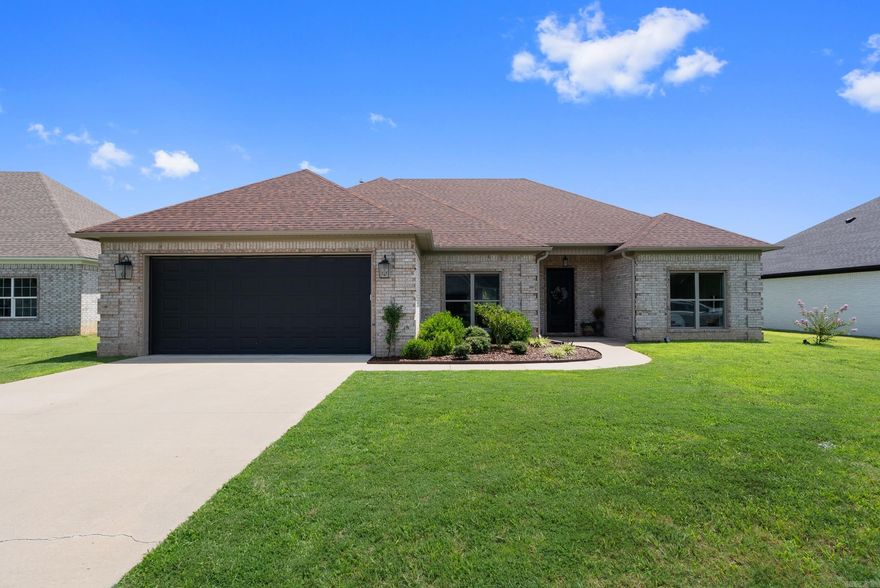 Beautiful home in River Plantation with a spacious open floor plan and welcoming entry featuring an iron front door with operable glass that opens to function as a screen—perfect for enjoying nice weather. The Great Room includes a gas fireplace with a tiled surround and board and batten trim work, creating a beautiful focal point. The kitchen features quartz counters, custom cabinetry, a gas range, double oven, and both a breakfast nook and formal dining room. Split bedroom layout with bathrooms featuring granite counters. The primary suite offers a walk-in shower, large walk-in closet, and a newly added window above the tub. Enjoy the large covered back porch and the privacy of the open field behind you—just minutes from Maumelle, Little Rock, and Conway! The current owners love the walking trails throughout the subdivision and the close proximity to the River.