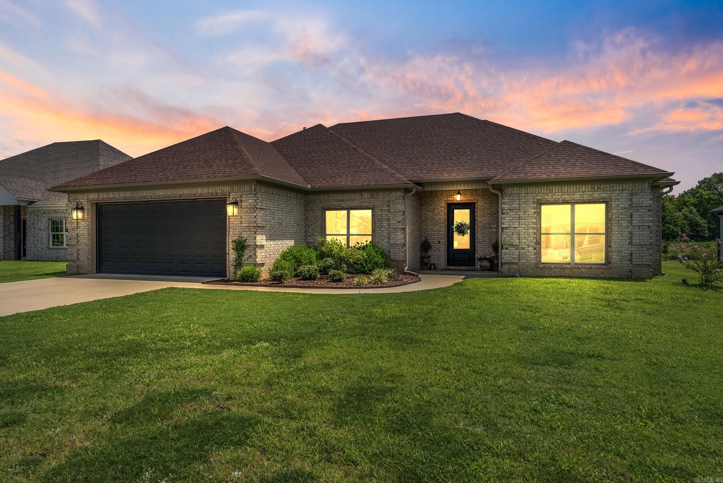 Beautiful home in River Plantation with a spacious open floor plan and welcoming entry featuring an iron front door with operable glass that opens to function as a screenāperfect for enjoying nice weather. The Great Room includes a gas fireplace with a tiled surround and board and batten trim work, creating a beautiful focal point. The kitchen features quartz counters, custom cabinetry, a gas range, double oven, and both a breakfast nook and formal dining room. Split bedroom layout with bathrooms featuring granite counters. The primary suite offers a walk-in shower, large walk-in closet, and a newly added window above the tub. Enjoy the large covered back porch and the privacy of the open field behind youājust minutes from Maumelle, Little Rock, and Conway! The current owners love the walking trails throughout the subdivision and the close proximity to the River.