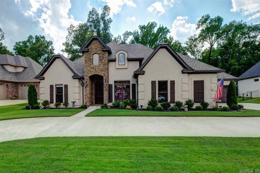 Unbelievable one story on private wooded, level lot. Outdoor living space complete with covered patio, cozy stone fireplace, and outdoor TV. Beautiful hardwoods, open floor plan with 2 large living areas. Chef's kitchen-gas cooktop, granite, stainless steel appliances, butler's pantry/bar, 2 breakfast bars. Master suite- soaker tub, granite and tile shower. Mud room, 3 fireplaces, 10' ceilings, and circular drive. Quality and elegance! Exterior is ALL brick with stucco decorative overlay.