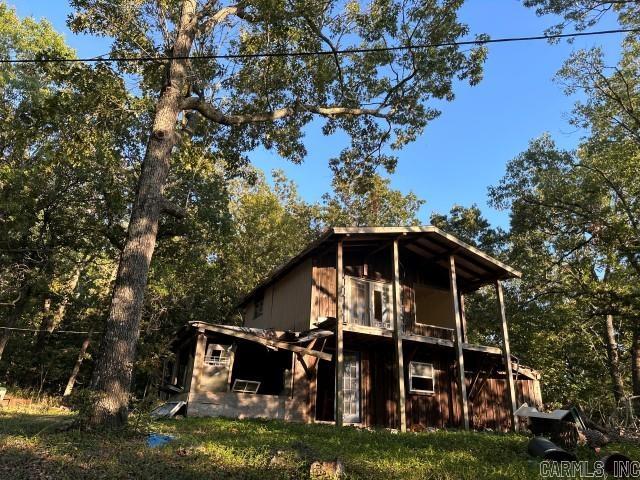 UNCOVER A HIDDEN TREASURE within the city limits of Bull Shoals, a remarkable acreage that offers the allure of seclusion and the convenience of urban living. Tucked away at the end of a road and adjoining land owned by the USA, this property offers a level of privacy that's truly exceptional-no neighbors in sight. With power readily available you have the shell of an old cabin to transform into a dream retreat. Whether you envision a cozy get away or a full-scale residence, this property accommodates your vision. The prospect of possible water on the property adds to its appeal, offering an added layer of convenience. Make your vision come to life and uncover the potential of this acreage in Bull Shoals today!