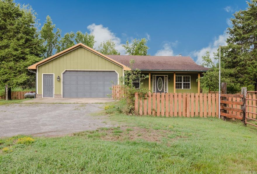 WELCOME TO FARM HOUSE FABULOUS!  3 Bedroom. 2 bathroom home on 8 acres in the highly sought after Vilonia School District! Sit on your wrap around porch and watch the wild life all around you while your pets enjoy the fully fenced backyard. This move in ready home welcomes you into an open concept kitchen, dining, living combo that is perfect for gatherings with friends and family. The Master suite has french doors for private access to the back porch. The master bath has cast iron claw foot tub and separate shower. A LARGE 50x30 SHOP with two bays features another 700sqft of heated/cooled space with half bath, perfect for your home gym or man cave.