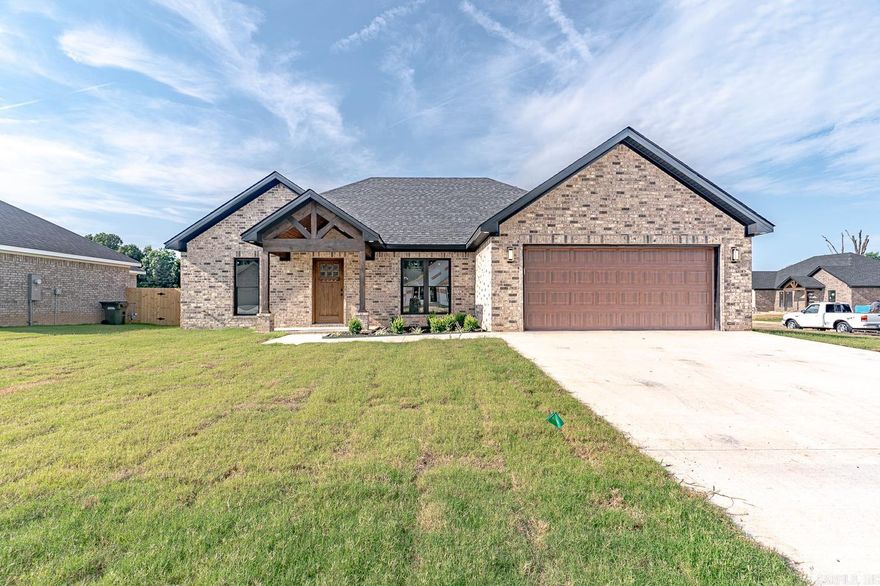 Welcome to Market 400 Gia in Bono, AR!  This stunning New Construction is a 3-bedroom, 2-bathroom all-brick Beauty! Property features:  Corner lot! Open concept! Electric fireplace with customizable flame color settings; a stunning gourmet kitchen equipped with black & white granite countertops, soft-close drawers, built-in electric oven, gas stovetop with vent hood, and a breakfast bar. Oh, & the cabinets are accented with lighting underneath!  The primary suite features a Gorgeous walk-in custom shower!  Come see this Beauty!