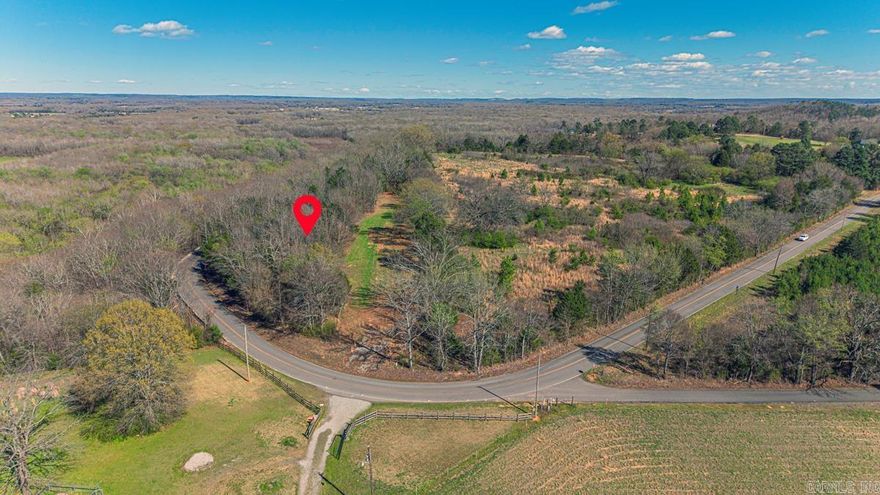 If you are looking for peace and quiet with a vista view, then you need to see this lovely unrestricted property. Several spots on this 8.36 +/- acres would be ideal for building your dream home. The land sits above Bayou Road, which curves and winds below the bluffs of the property. The location is only 7 miles from Hwy 65 in Spring Hill.