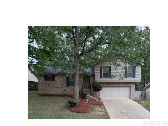 Beautifully maintained home with fresh updates creates move in ready opportunity. New roof in 2025, new HVAC in 2020, water heater in 2019, floors and stove in 2025 make for a sound investment for new owner. Wonderful vinyl plank flooring through out home, no carpets! Walk in closet in primary suite with ensuite bath as well. Lots of storage throughout. Eat in Kitchen and separate dining room and adjacent great room allow for easy entertaining. Huge back deck area adds even more to the fun spaces. Built in's around wood burning fireplace with gas logs. Storm doors front and back allow inviting approach for guests and bringing in even more natural light. Enjoy the bowed window in the kitchen while preparing delicious menu's on clean counters and cabinets with new stainless-steel appliances. Oversize two car garage with lots of extra storage and easy access to even more storage under house. Leaf guard style gutters, security camera's/system will convey to buyer for ease of maintenance and peace of mind. Super convenient location to great West Little Rock shopping, dining, medical, and entertainment options for those with active lives on the go!!