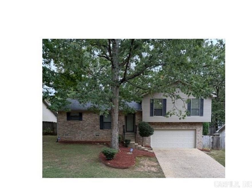 Beautifully maintained home with fresh updates creates move in ready opportunity.   New roof in 2025, new HVAC in 2020, water heater in 2019, floors and stove in 2025 make for a sound investment for new owner.  Wonderful vinyl plank flooring through out home, no carpets!  Walk in closet in primary suite with ensuite bath as well.  Lots of storage throughout.  Eat in Kitchen and separate dining room and adjacent great room allow for easy entertaining.  Huge back deck area adds even more to the fun spaces.  Built in's around wood burning fireplace with gas logs.  Storm doors front and back allow inviting approach for guests and bringing in even more natural light.  Enjoy the bowed window in the kitchen while preparing delicious menu's on clean counters and cabinets with new stainless-steel appliances.  Oversize two car garage with lots of extra storage and easy access to even more storage under house.  Leaf guard style gutters, security camera's/system will convey to buyer for ease of maintenance and peace of mind.  Super convenient location to great West Little Rock shopping, dining, medical, and entertainment options for those with active lives on the go!!
