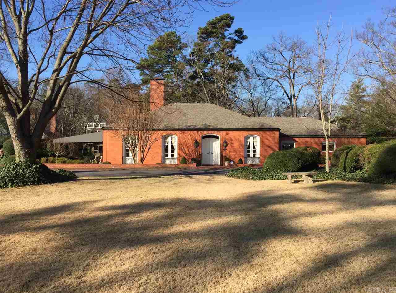Remarkable French 'Jewel' of a home.  Superb location adjacent to LRCC.  10' ceilings, 8 1/2' in kitchen/family room.  9 sets of French doors, hardwoods, marble and carpeting, 3 fireplaces, remodeled kitchen in 2012, H&A in 2009, roof 2006, whole house generator, two bedrooms and 2.5 baths on main floor.  One bedroom and one bath down.  Formal living room and dining room, covered brick patio, 2 car garage.  Very special property!!