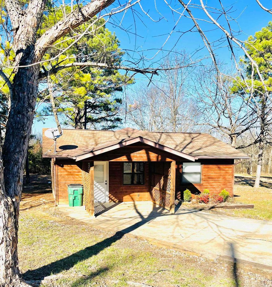 Investor Special Near Norfork Lake & North Fork River! This unique 10-acre property offers two dwellings, making it ideal for short-term rentals, a family compound, or income potential. The cabin—formerly part of Gene's Trout Fishing Resort— is a charming getaway featuring an open floor plan, two spacious bedrooms, and a large bathroom. The second dwelling is a 3-bedroom, 2-bath mobile home in need of light repairs, offering added value and flexibility. Enjoy outdoor living with a covered deck, outbuilding, and expansive backyard—perfect for gatherings and recreation. Located just 8 minutes from Gene's Trout Fishing Resort and the Norfork Lake Dam, and within walking distance to the popular Grill at Whispering Woods,  this property is perfectly positioned for fishing, lake life, and relaxation.  A rare opportunity with acreage, multiple dwellings, and strong investment potential.