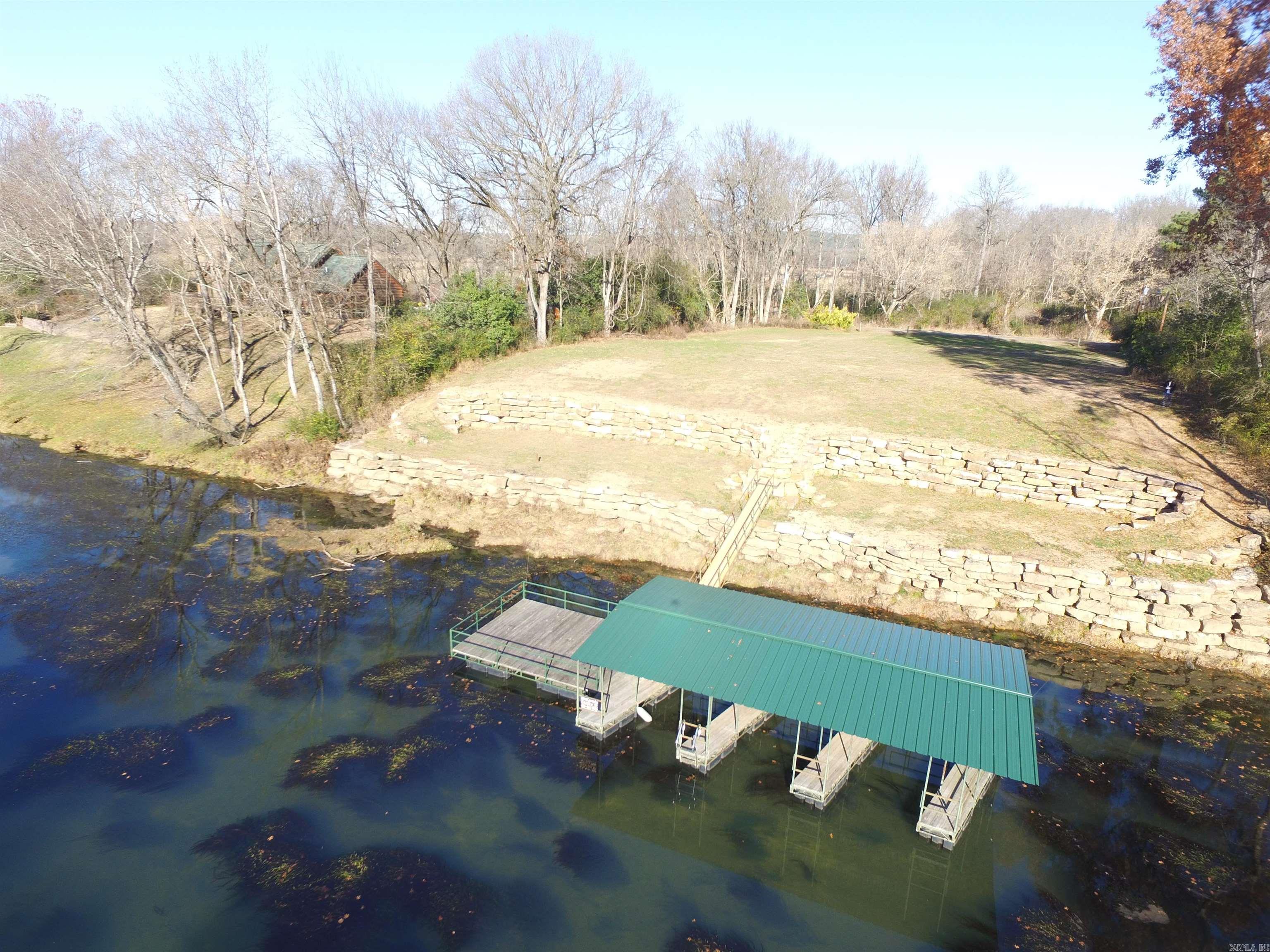 Absolutely one of the best river lots we've ever seen! Very large lot at the end of River Bend Road with a three slip dock with new roof and extensive riverbank erosion control. A spectacular building site!