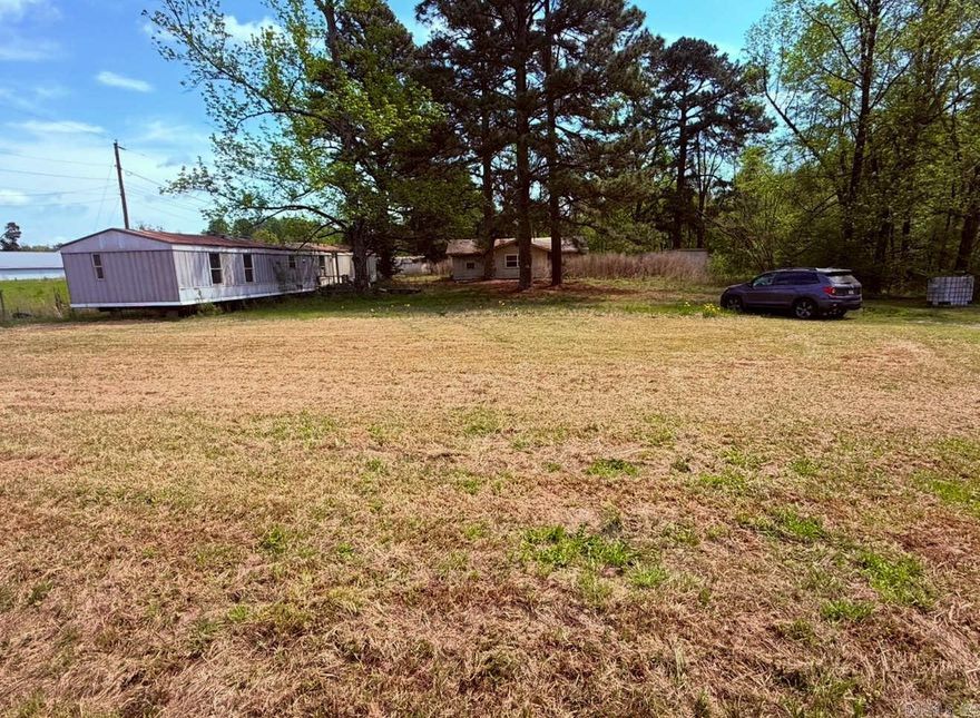 SO MUCH POTENTIAL!!! Eight acres including a home that could be repaired and a mobile home that is extra storage! Build your dreams here!