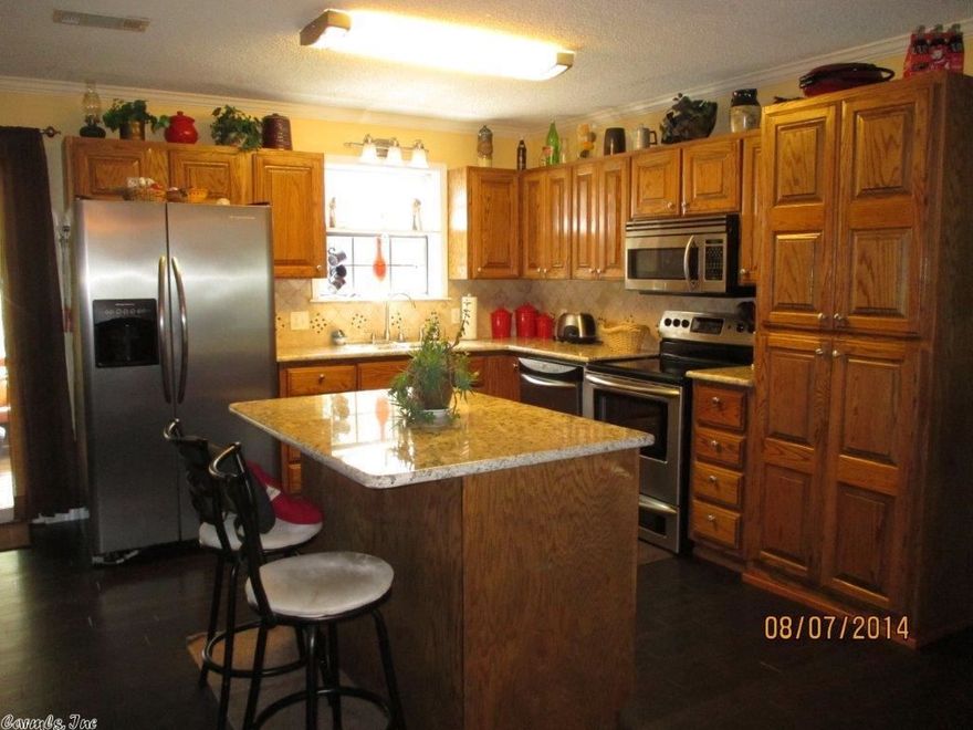 2 Houses on 16.5 acres. Yr round creek & lg pond in LHSD. Brick, 3BR/3B w/ office-den,sun room, Kit w/ granite, tile backsplash, nice oak cabinets, brkfst bar, new paint & floors incl hardwood laminate.New CH&A, Bathrooms tile floors, lg walk in shower, soaker tubs.  Back house efficiency blt 2005 has kit w/gas stove, 3 w/in closets, full bath, laundry, nice cov deck, fenced yard. Barn 24 x 24 w/ 12 x 24 add on incl workshop.Park 3 vehicles in barn &stg upstairs.