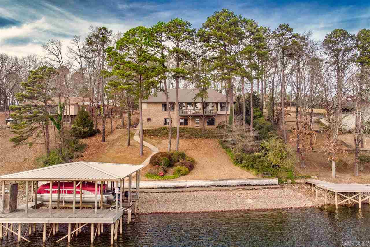 Welcome to this beautiful lakeside home on prestigious Long Island. All surfaces have been touched in the last 3 years including paint, tile, flooring, 2 new HVAC systems, new stove, fridge, wall oven/micro combo as well as a brand new double boat dock and sea doo dock with remote control hoists! Make your showing appointment today to view this outstanding lake estate.