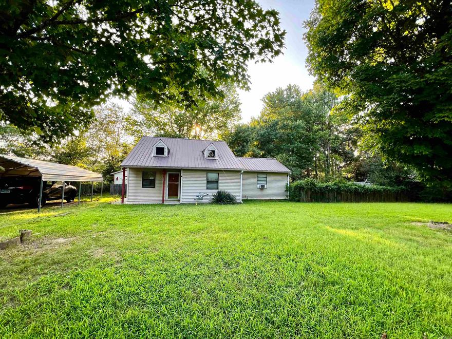 3-bedroom, 1-bathroom starter home with country views. Spanning 1,196 sq ft, this home is set on a 0.43-acre lot, offering plenty of space both inside and out. Enjoy the open feel of vaulted ceilings, enhancing the spaciousness of the living areas. The large fenced backyard is perfect for pets, gardening, or entertaining, offering a private space to relax and enjoy the fresh country air. The metal roof not only adds character but ensures longevity and low maintenance. Just minutes from town, you’ll have the convenience of nearby amenities while savoring peaceful country views. Whether you're just starting out or looking to downsize, this home may be perfect for your next chapter.