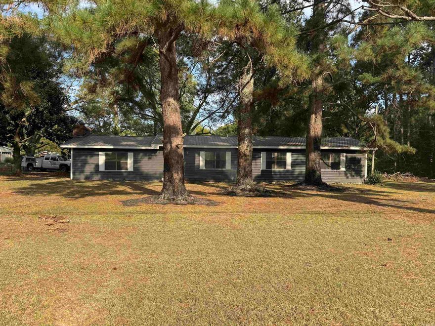 ADORABLE COUNTRY HOME SITTING ON 4 ACRES! Remodeled with new floors, paint, and cabinets, and more including HVAC, new metal roof, new water heater and more. This home boast 1793 sq ft and has 2 living areas, eat in kitchen, and 3 bedrooms and 2 baths! Go outside and enjoy the beautiful grounds with trees and a shop and a barn. This home has so much to love!  Call me today and let me give you a tour!