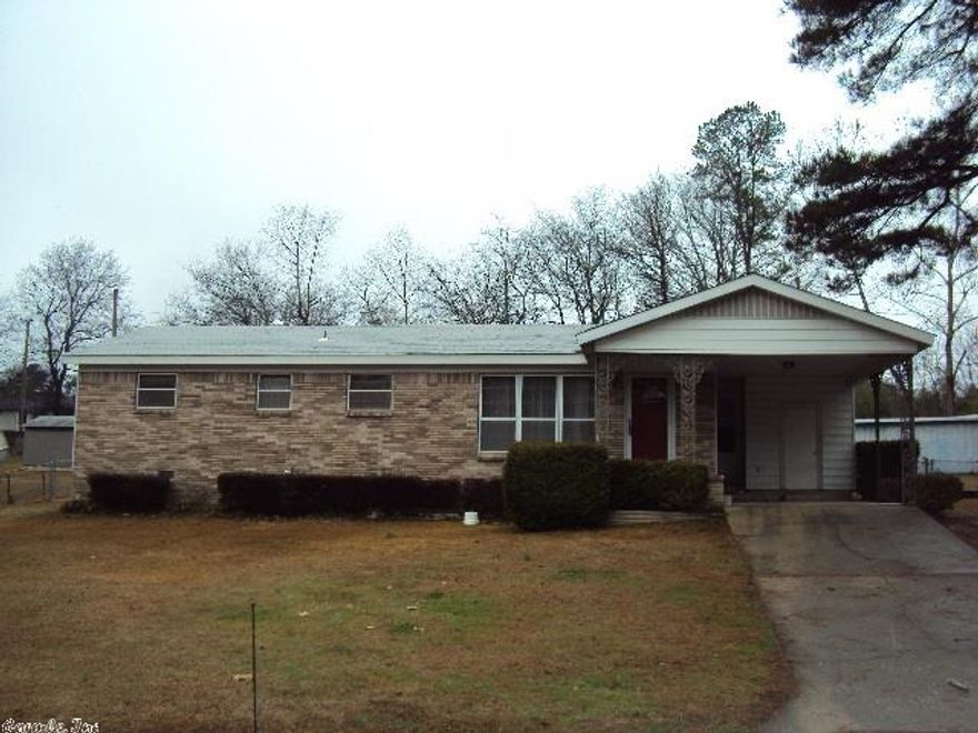 Nice well kept starter or move down home! Super clean and neat, this 3 bedroom , 1 1/2 bath one-owner home features true hardwoods in the bedrooms and carpet in the huge living room and the large Bonus room that would be great for entertaining! Bonus could serve as a huge dining room also. Electric fireplace in great room. Convenient to schools and shopping! Roof and heating/air are 4 years old. Picket Fence around back porch and entire large yard fenced! Storage room on carport. Very clean and neat!!