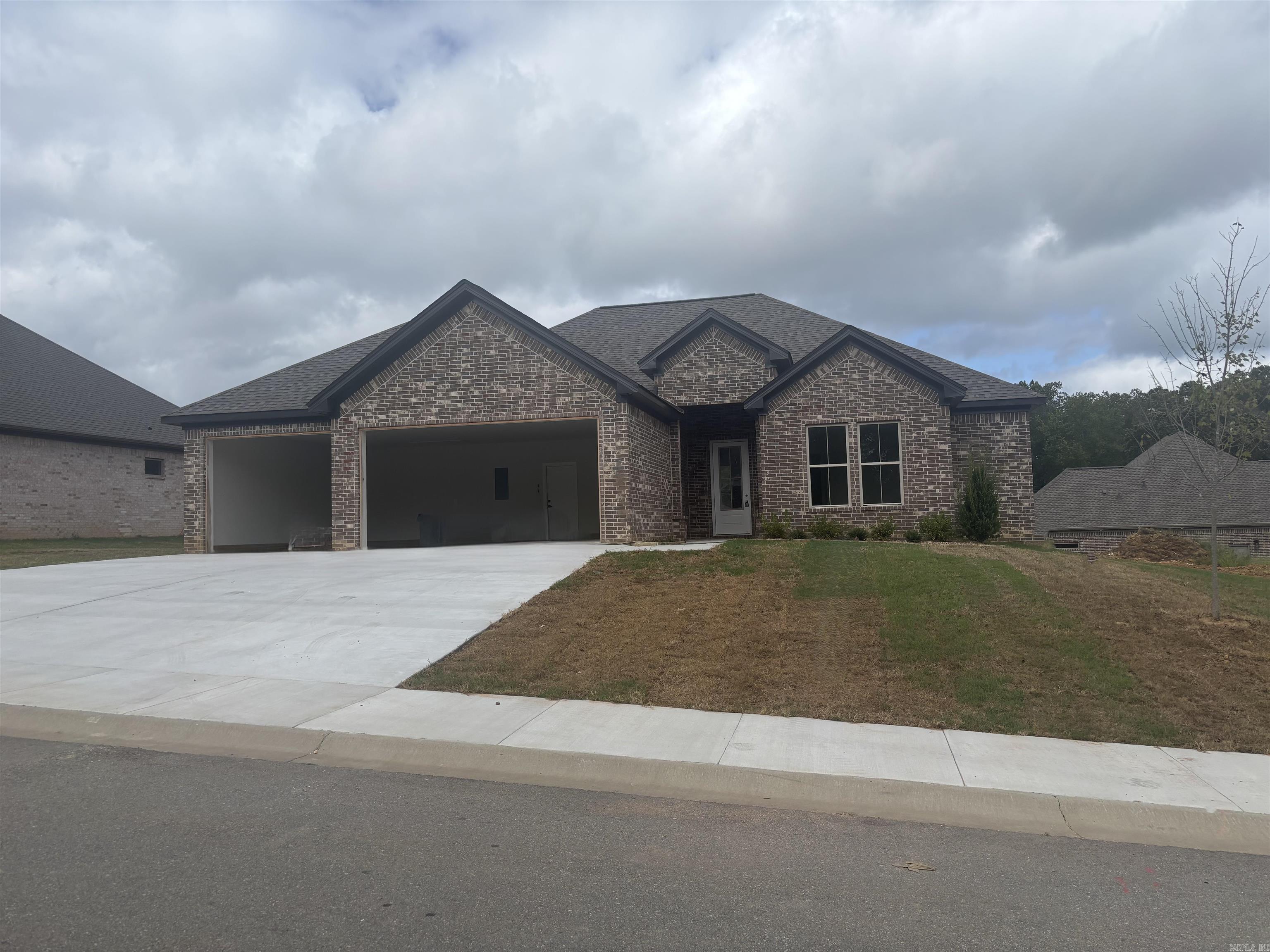 THREE CAR GARAGE!!! Large covered back porch, extra landscaping. LVP flooring , custom cabinets with large island, wall oven, gas cooktop. butler pantry, also regular pantry. Primary has tile shower with separate tub, large closet.