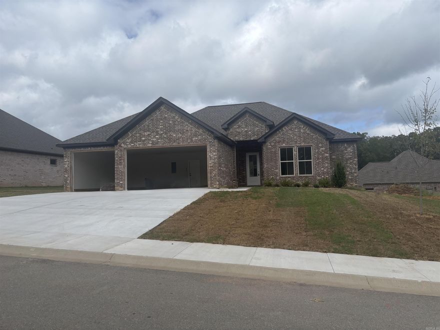 THREE CAR GARAGE!!! Large covered back porch, extra landscaping. LVP flooring , custom cabinets with large island, wall oven, gas cooktop. butler pantry, also regular pantry. Primary has tile shower with separate tub, large closet.