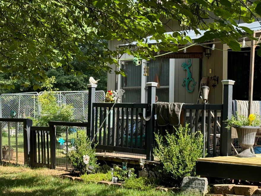 SHOAL BAY area is where you'll find your dream home or weekend getaway. Just a short stroll to boat ramp & Beach for swimming.  This home is ideal for those who love Lakeside living.  Step inside to an inviting open floor plan with high ceilings, creating a bright and airy ambiance. Add a sky light for perfection. The well-thought-out kitchen features numerous cabinets, new countertops and unique backsplash that adds a touch of character.  All Appliances less than 3 years old stay, making your move-in seamless.  Nestled on a meticulously maintained 1-acre corner lot provides ample space for outdoor living. Two outbuildings offer additional storage or guest house,  Mature Red Bud Trees provide ample shade, making the deck and house a cool retreat. House built around a Steel Frame