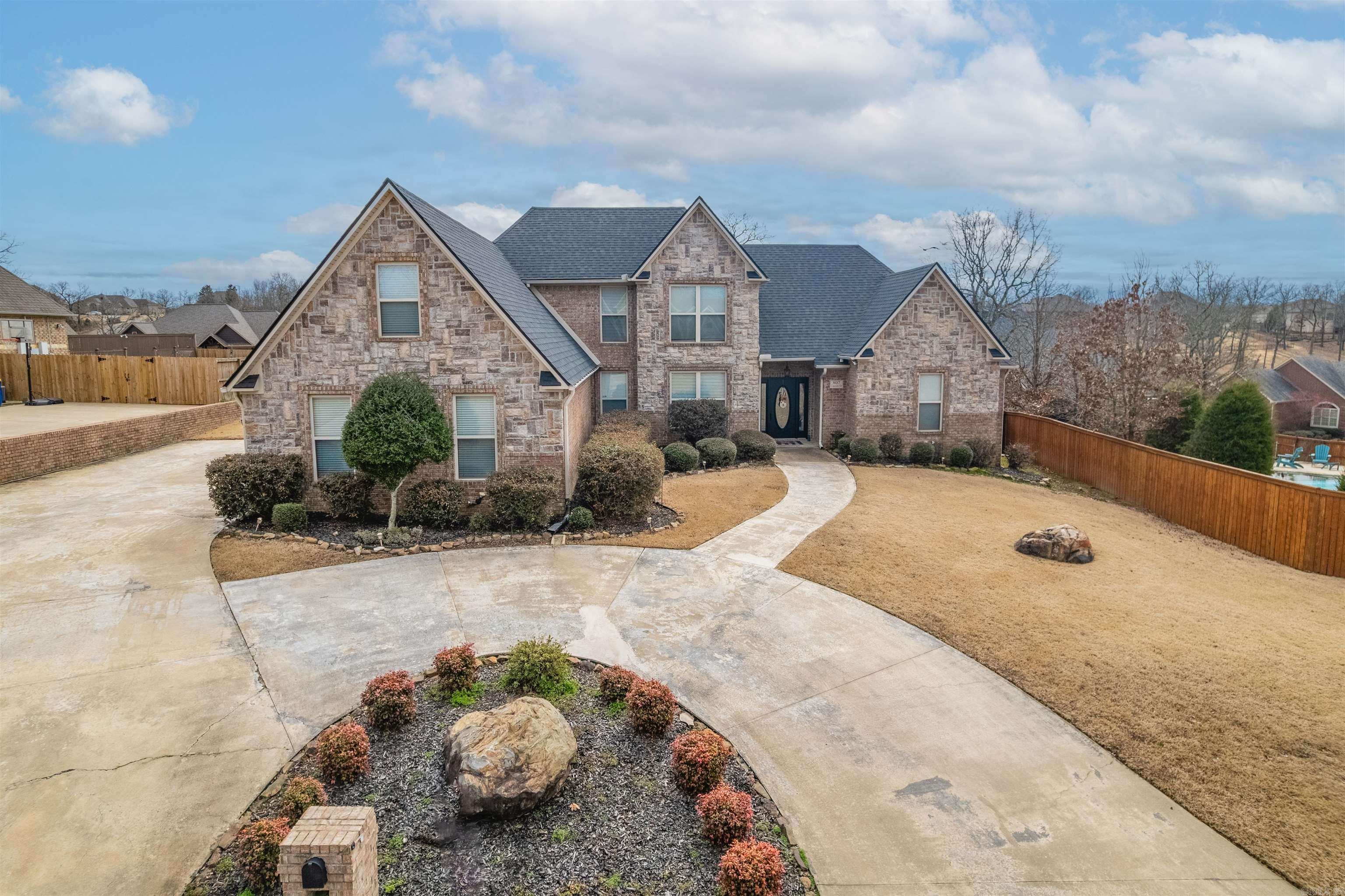 She's a Brick House & a Big House! The home was designed for a large family or multiple family's. Enter the home & be welcomed by the foyer w/tile flooring. Ahead is spacious Living Room w/high ceilings overlooking the backyard & on the left is an Office or Dining Rm. Notice the calming colors & crown molding trim in abundance! To the left is an amazing kitchen, island & bar area overlooking the Breakfast area & Den! Upgrades at every corner from trim, to appliances, paint, & ample seating space! Back to the Foyer & on your right is the Master Bedroom w/soaring ceilings and a spaciously styled Master Bath too! The Master Bedroom is located on the rear of the home w/the Master Bath facing the front of the home. The walk in tile shower is sought by many! His and Her vanities as well not to mention ample closet space. Off the kitchen we head upstairs for multiple bedrooms & bath + office. Upstairs is like another home for lots of privacy! Do not forget the fantastic side entry 3 car garage too! Plus the ample parking! The backyard is a slice of peace w/landscaping along the fence line & a covered pergola for relaxing outside too! $7,500 Closing Costs Option too. See Agent Remarks.