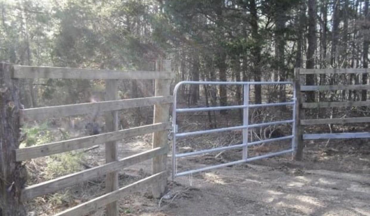 Great piece of property for hunting or hunting club. Lots of places to build that perfect cabin. Quiet and peaceful. The electricity is available and is near the acreage line. There have been signs of deer, bears and wild hogs. Level on top. Slopes down to two creeks. The water runs underneath one at one point. The seller has never seen one of the creeks dry. Has some pools of water. Some giant boulders along the creek at some points. The timber on the west size is really big and on the east side mixed timber. See remarks.