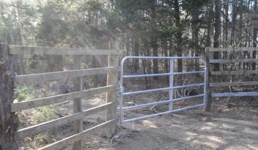Great piece of property for hunting or hunting club.  Lots of places to build that perfect cabin.  Quiet and peaceful.  The electricity is available and is near the acreage line.  There have been signs of deer, bears and wild hogs.  Level on top.  Slopes down to two creeks.  The water runs underneath one at one point.  The seller has never seen one of the creeks dry.  Has some pools of water. Some giant boulders along the creek at some points.  The timber on the west size is  really big and on the east side mixed timber.  See remarks.