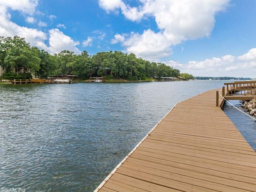 Water front!! Lake Hamilton Condo with 2B.2.5 Ba. beautifully updated. Features include covered parking, cover boat slip with lift and storage area. This complex comes with a place to store your boat trailer. In Lakeside Schools.