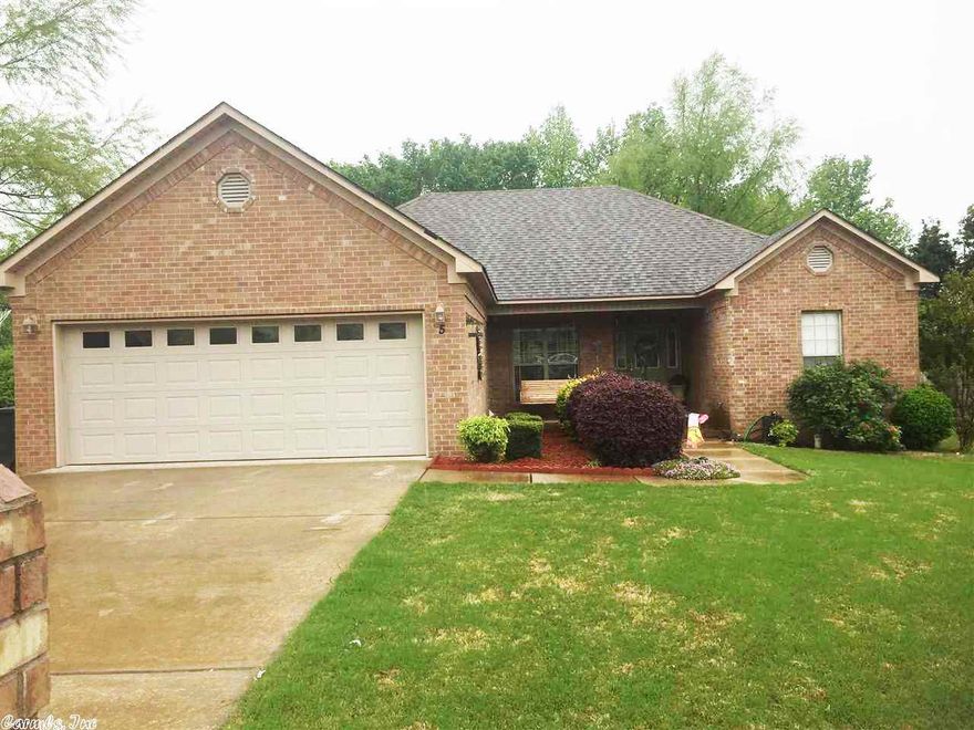 Beautiful open three bedroom two bath home with lovely fireplace and tray ceilings in living room. Kitchen is open to living room and dining room with breakfast bar. It also has a pantry! This gorgeous home has a split floor plan with a large master bedroom with walk in closet and two sinks and tub with jets. On the other side of the house it has two large bedrooms and a bathroom. New keyless entry garage and awesome front porch and covered back porch all completely fenced in. A must see! see remarks