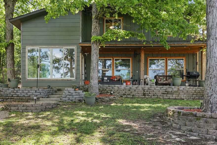 Lakefront Elegance with Historic Charm – Discover a sense of seclusion as you drive through acres of forest to your personal getaway. This one-of-a-kind lakefront gem at 111 Loveless Lane is a stunning 3-bedroom, 3.5-bath home with a flexible bonus room that could serve as a 4th bedroom. Perfectly positioned on the water, it blends luxurious comfort with rich local heritage.  Inside, carved wood accents and a warm, inviting atmosphere create timeless appeal. The home features hardwood and luxury vinyl plank (LVP) flooring throughout, offering both style and durability. A standout addition is the private sauna in the hall bath, creating a spa-like retreat. Historic artifacts from Hot Springs’ iconic Bathhouse Row add distinctive character and honor Arkansas history.  Step outside to your private covered boat dock with a swim deck—perfect for lake days or quiet mornings with coffee. A large gun safe conveys at no value, and a 1-year Home Warranty is included with an accepted offer.  This home is more than a residence—it's a lifestyle. Come experience the beauty, history, and luxury of lakefront living at its finest.