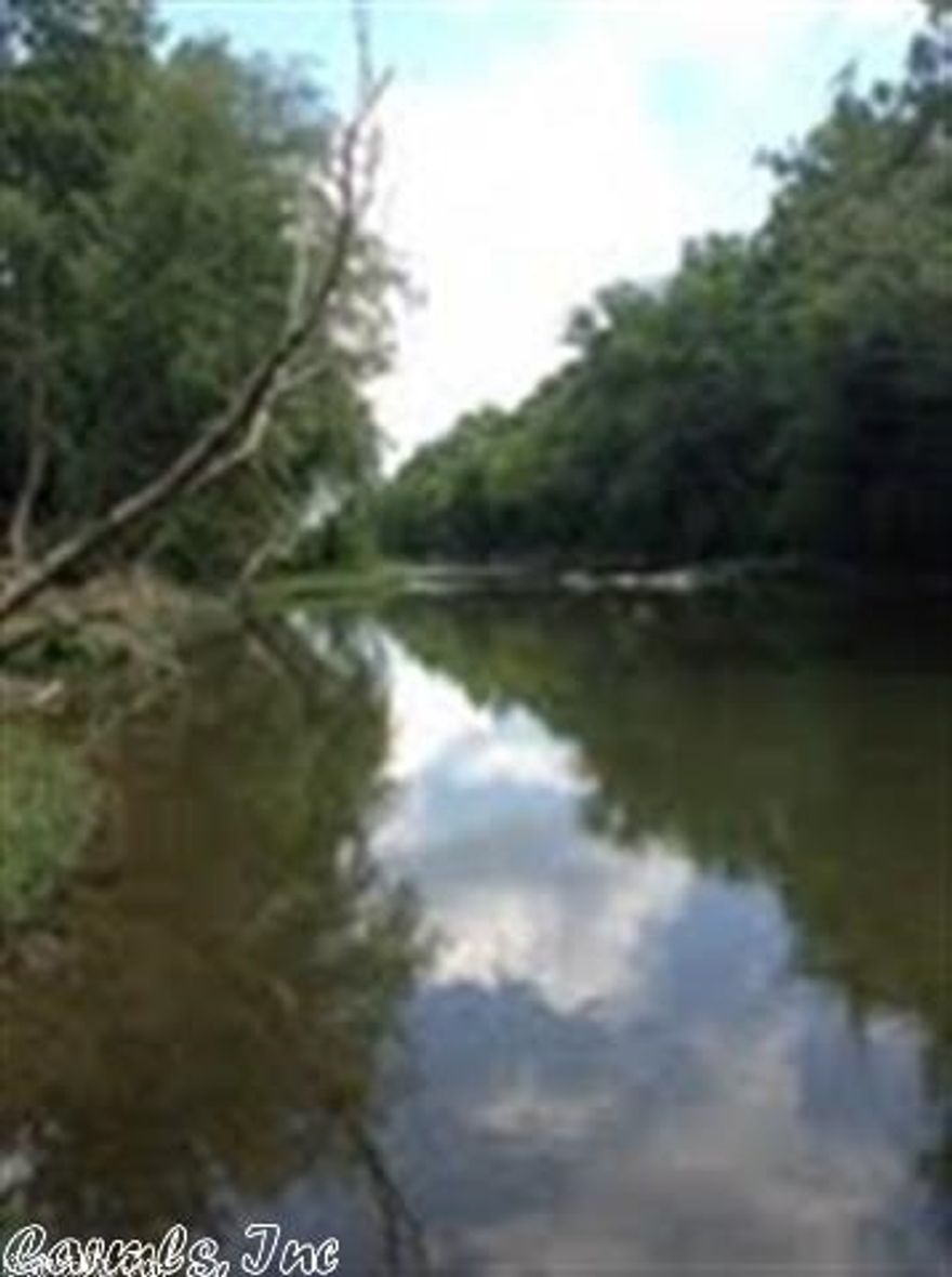 This is an opportunity to own a prime tract of land on the Caddo River with all utilities available.  Build your cabin or have your own RV site (there are some restrictions to protect the values of the properties).  Possible owner financing.