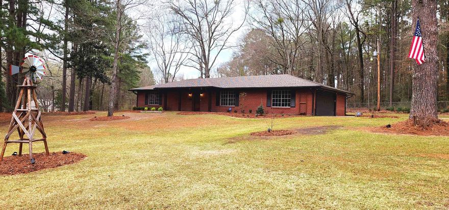 Not too far from town.. Small Acreage.. Move-In Ready... This home is exactly what you've been looking for! Located in the El Dorado School District, this recently renovated 3 Bedroom, 2.5 Bath brick home enjoys a beautifully landscaped property in a peaceful country setting. Improvements include but are not limited to:  * Painting, flooring, lighting updated throughout * New Carpet 2023 * Roof and HVAC replaced 2021 * Updated Stainless Appliances and concrete countertops * New fencing/gate added 2021-2023 * New Gutters with Leaf Filter 2023 * Exterior Renovation- New front door, porch extension, columns, pavers 2023 * New Graceland Storage Building 2023 * Custom Firepit with exterior furniture/ Custom garden area 2024 * Extensive landscaping, solar lighting, tree removal 2023 * Generator Maintenance 2023 * Septic Maintenance- 2021 * ADT security system components  and Google Nest thermostat will remain  An updated survey is underway and can be provided soon. Square footage was used from the most recent appraisal of the home. A complete list of all recent improvements is available.