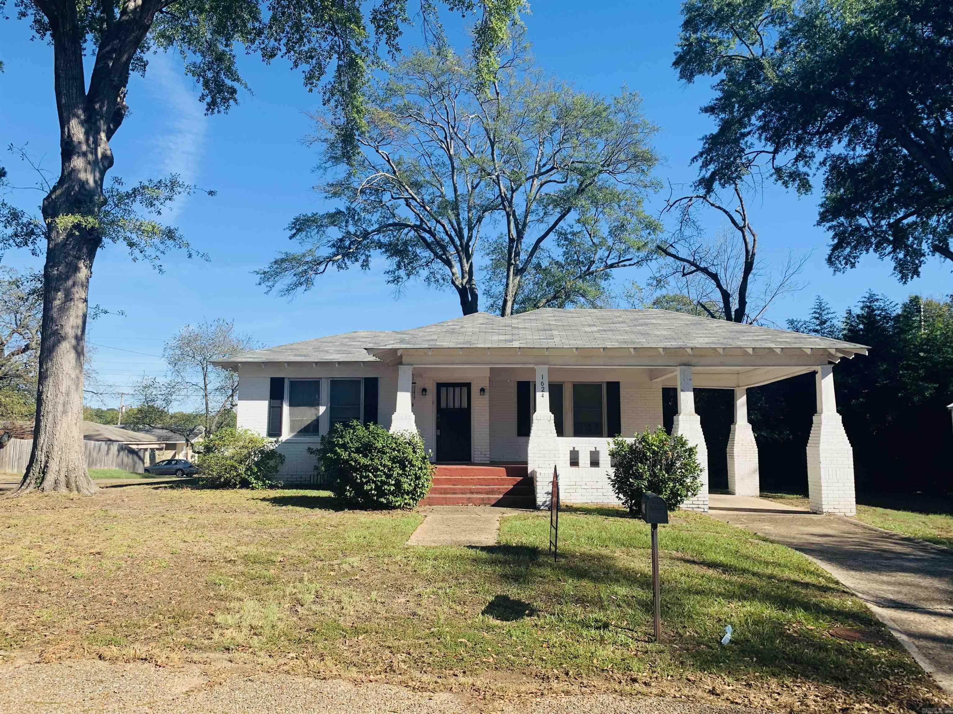 Charming and full of character, this 1930 brick home offers 2 bedrooms, 1 bath, and approximately 1,508 sq ft of cozy living space on a corner lot and a block from Arkansas High School! Youāll fall in love with the beautiful hardwood floors, upgraded features, and a welcoming mock fireplace. The home includes a versatile bonus room that could easily serve as a third bedroom, a fenced yard perfect for privacy, a one-car carport, and a new outbuilding for extra storage. Surrounded by lush landscaping, this property combines classic appeal with modern touches, making it a true gem!