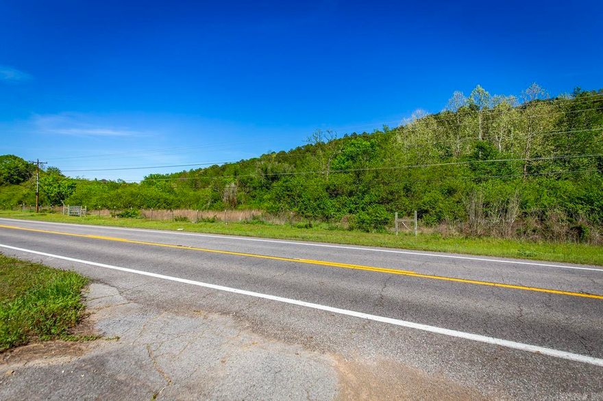 Nice country setting with 2 creeks and 2 lane highway frontage, giving you access to all utilities, including fiber internet. This used to be an old homestead and a boarding house, where people getting off the old M&NA train would stay and it has been said that a septic is on the property (not verified). Approximately 6 out of the 13.04 acres is level and ready for any type of livestock or home sites. This is a great property for you to build a home on or multiple cabins along the creek for vacation rental. Call the Listing Agent for more information and to schedule a showing. Greers Ferry Lake at Fairifeld Bay is just 5 miles away. Enjoy dining, shopping, 90 miles of side by side riding boating, skiing, and more. The Little Red River at Shirley is just 2 miles away where you can kayak, fish, and swim.