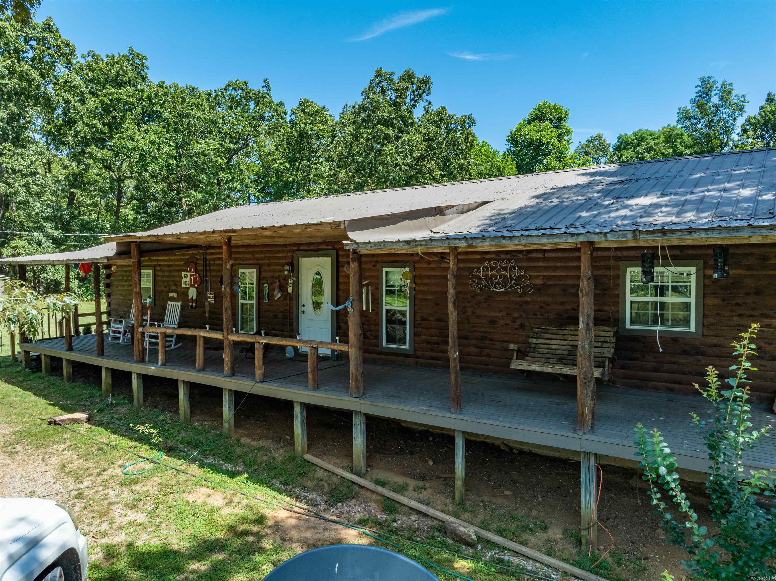 This beautiful log home sits on approximately 21 +/- acres of timberland, offering privacy, peace, and incredible wildlife views. The home features 4 bedrooms, 2 bathrooms, and an open floor plan connecting the large living room, kitchen, and dining area. Enjoy the outdoors from the full-length covered front and back porchesāperfect for relaxing while watching hummingbirds feed and deer wander up to the yard. Property includes a nice shop, carport, fruit trees (including a loaded apple tree), and great garden areas. Down the drive in the back is a second dwelling (mobile home) sits tucked away from view. It will need a full remodel but is included with the sale and could be repurposed. Excellent hunting, mature timber, and peaceful surroundings make this property ideal for outdoor lovers. All just 10 minutes from downtown Cave City!