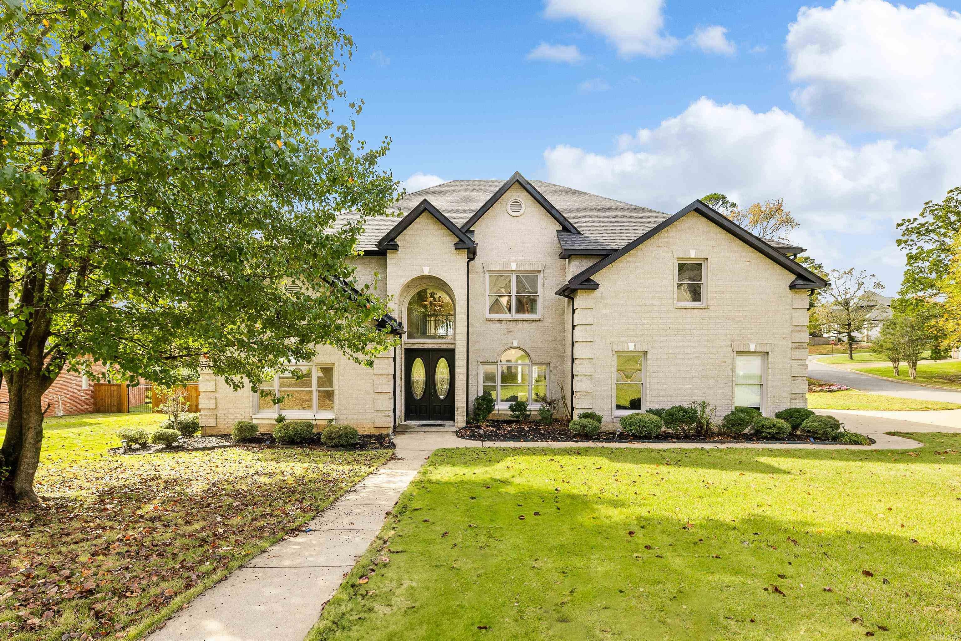 Welcome to 101 Noyant, a stunning 5 bedroom, 4 and a half bath home nestled in the LaMarche Neighborhood of Chenal Valley. Situated on a gorgeous half acre corner lot, this property offer the perfect combination of elegance and space. The home boasts spacious sunlit rooms, a expansive kitchen space with space for everyone, as well as formal living and dining spaces. The primary sweet on the first floor offers a luxurious, space like ensuite with dual closets. Upstairs you will find a second ensuite with a private balcony, plus 3 more large bedrooms and 2 more full baths. The media room is expansive. Recent updates include new hardwoods on main floor, new carpet in the downstairs primary, all new baths, paint and a new roof! Come see this gorgeous home today! Agents - Please see private remarks.