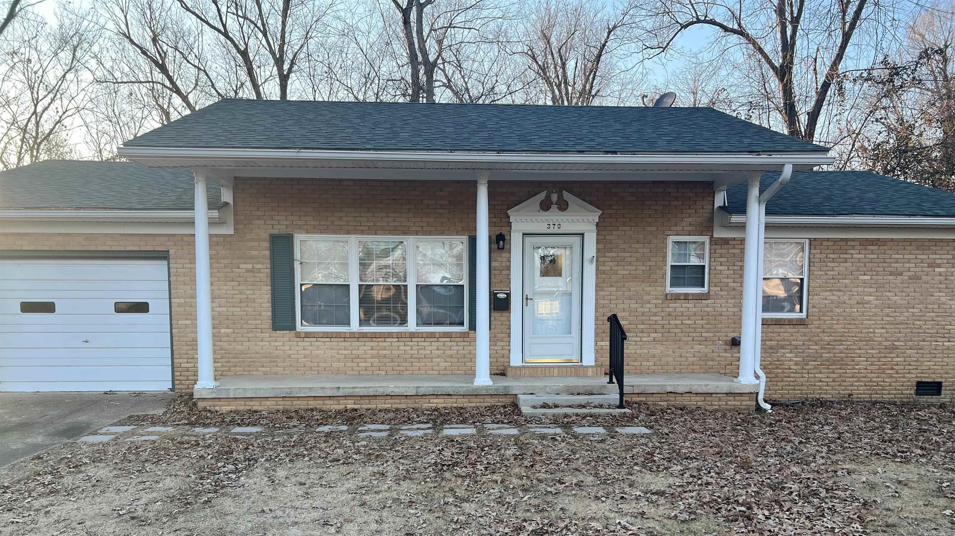 Move in Ready 3 Bedroom, 1 1/2 baths! Looking to make a move in the New Year? Then you need to see 370 Lamb Dr in Piggott, AR! This home has numerous update including: New- Central AC Unit, hot water heater, gas stove, kitchen countertops, sink & facet, garbage disposal, new flooring-kitchen/landry room and living room, new lights, ceiling fans, new commodes , exhaust fans in bath, as well as the walls and woodwork have been freshly painted. The bedrooms have beautiful original hardwood flooring and are gorgeous! PLUS the roof is only approximately 7 years old per seller. Located on a cut-du-sac, with mature trees, you'll enjoy the quiet peaceful setting. The front porch is inviting and is the perfect place to sit back and relax. Upon entering the front door you will find the living area spacious and it has lots of natural light pouring in. The kitchen is large and has lots of cabinet space. The Landry area is off the kitchen. There's a half bath off the Landry area and has a cool barn door. The entrance to the one car garage is located off the kitchen and allows easy access for unloading groceries. This home has a lot to offer and is ready for new owners!