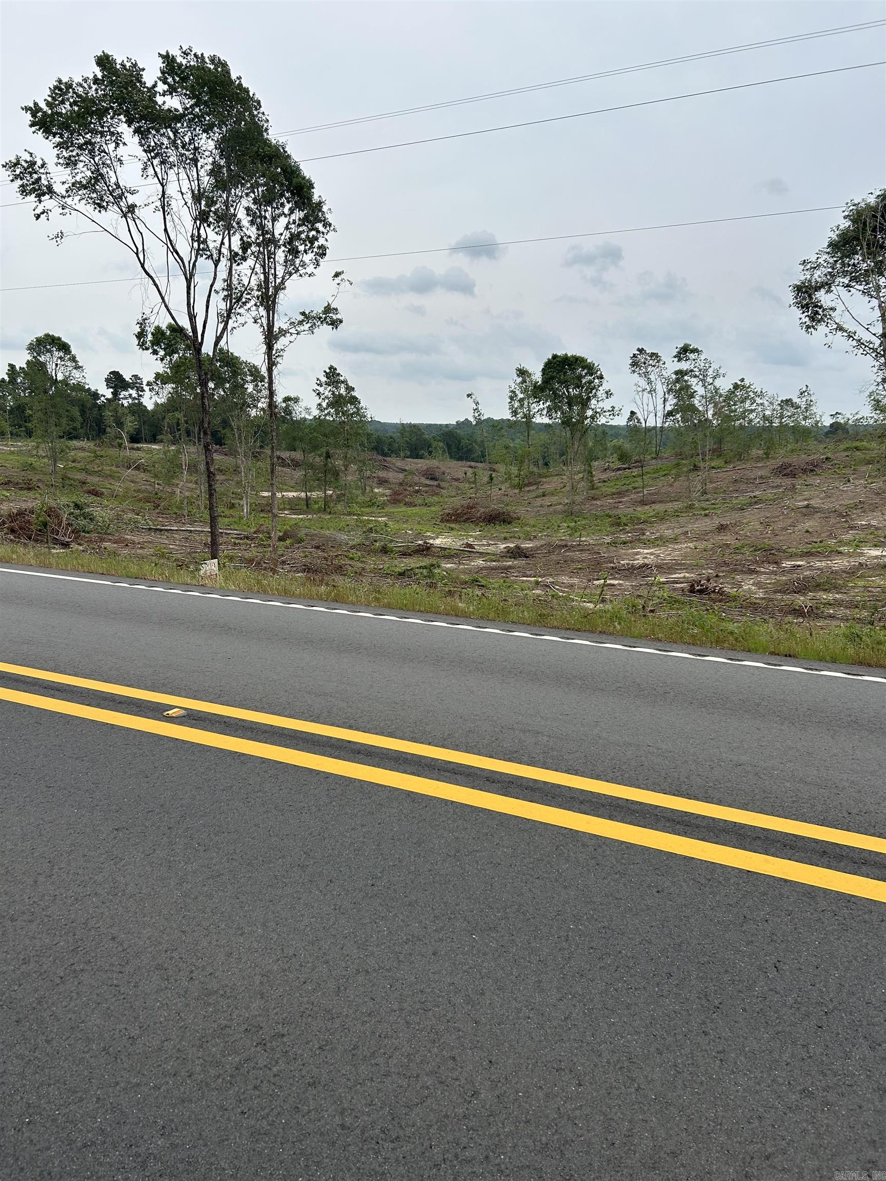 Great land investment opportunity, approx 64 acres of land, mostly clear-cut, with scattered hardwood left in areas great for a house place, property is located approx 5 miles from Millwood Lake and approx 1/4 mile from Grassy lake hunting club. This property has 2 areas that you could make a large lake, yellow creek boarders the east side of the property. Water and electric available at road. Highway frontage, on Hwy 355 south out of Saratoga. Contact our office for more details.