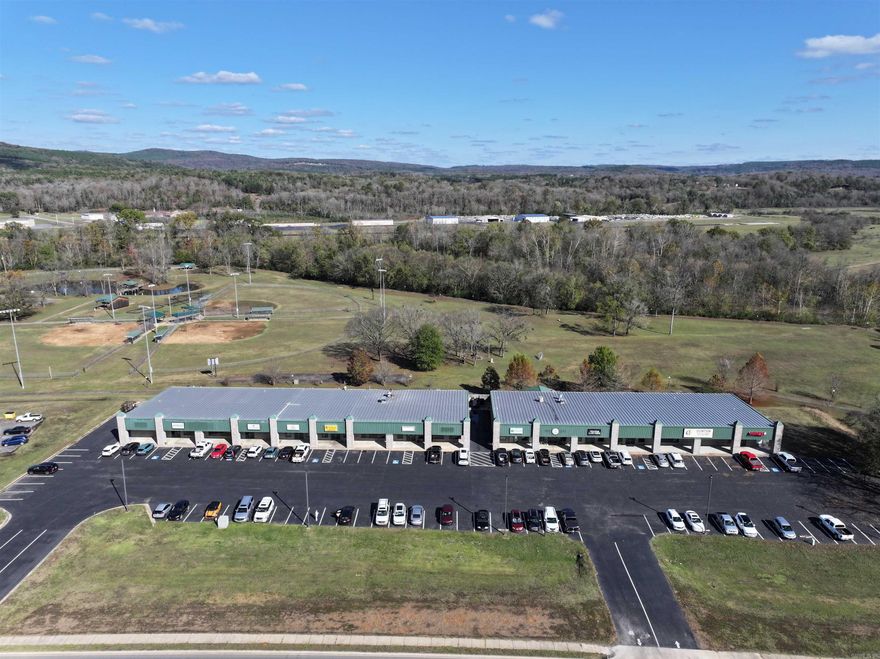 Located at 244 Hwy 65 N in Clinton, Arkansas, this well-maintained retail center offers strong visibility along Highway 65 with traffic counts of approximately 16,000 vehicles per day. The property features a ±13,500 square foot building situated on ±1.30 acres and includes recent capital improvements such as parking lot resurfacing and updated exterior lighting. Zoned C-2 (General Commercial), the center supports a variety of retail, restaurant, and service-oriented uses. Positioned directly in front of Archey Park and near Greers Ferry Lake, the location benefits from steady local traffic, recreational tourism, and a diverse tenant mix that includes restaurant and professional service